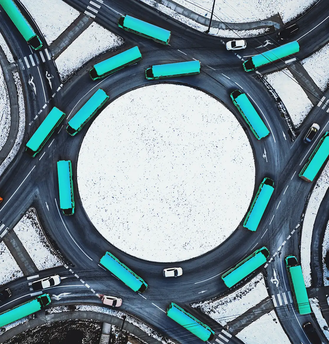 Trucks driving on a roundabout showing how cash flow financing fuels growth